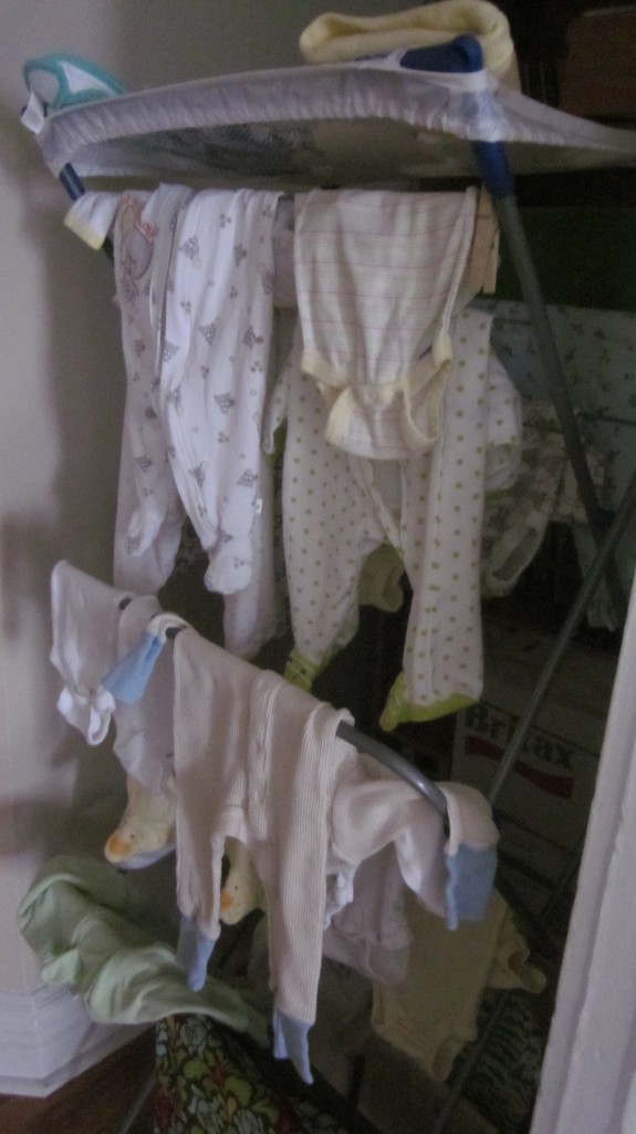 Isn't this a sweet sight?  I love seeing baby clothes hanging in my son's house!