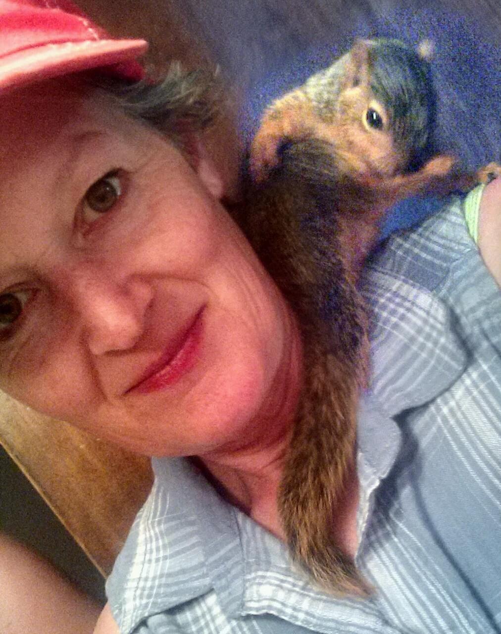 woman with squirrel on her shoulder