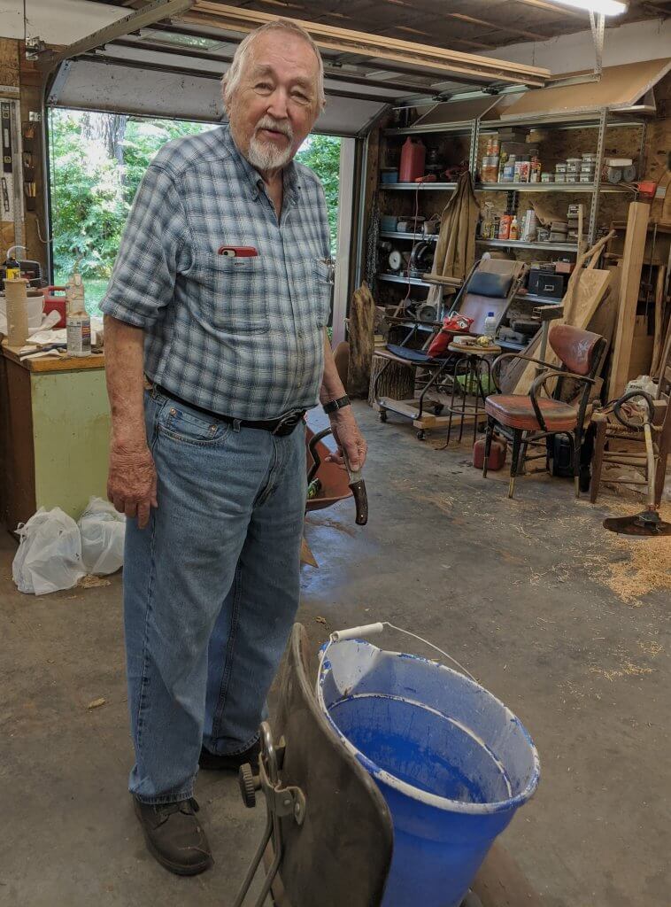 man standing in his workshop