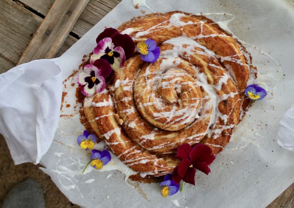 spiral of coffee cake with pansies