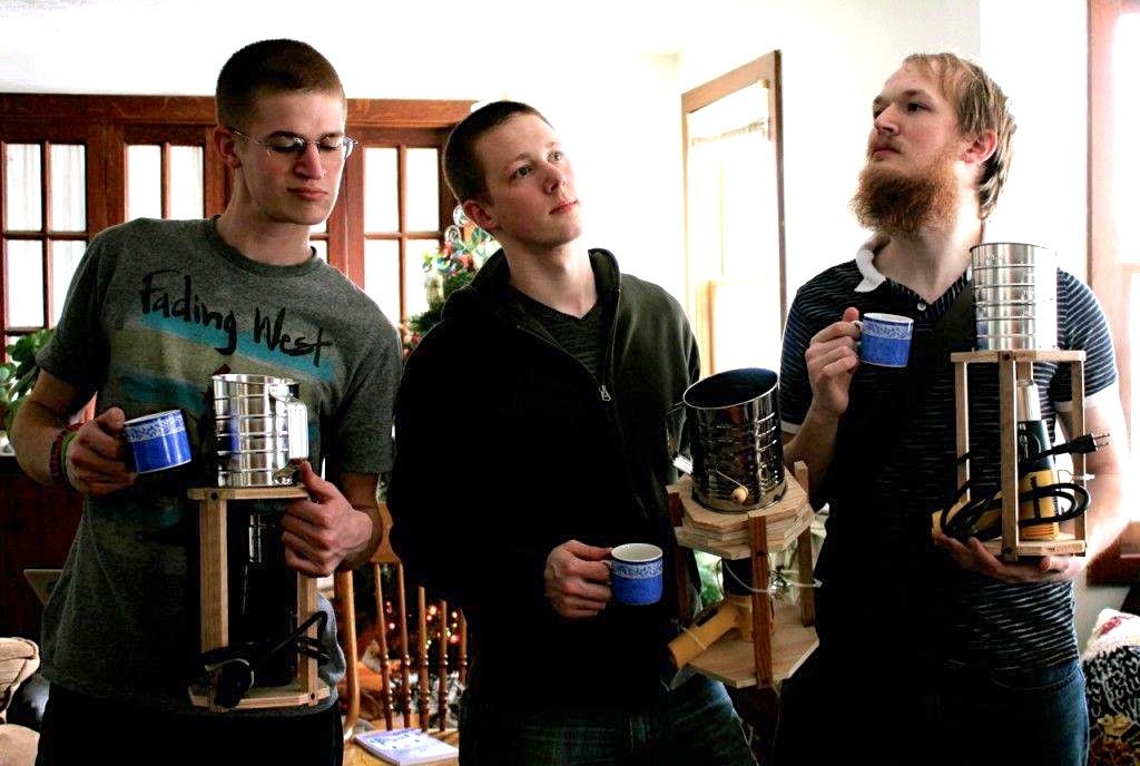 The guys in our family do have a weird obsession with roasting their own coffee beans. Here's proof of it: (from l to r) Timothy, Matthew, and Andrew posing with their new coffee roasters.