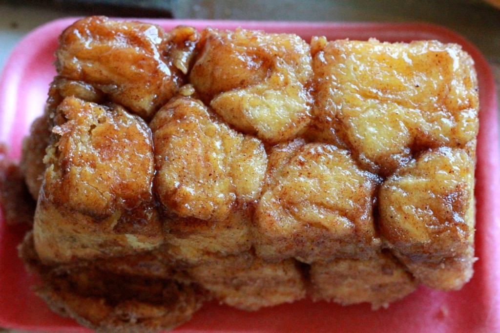 Everybody loves this caramel monkey bread and it is so easy: you just dip balls of dough into melted butter, and then cinnamon sugar, and then plop them in the pan. 