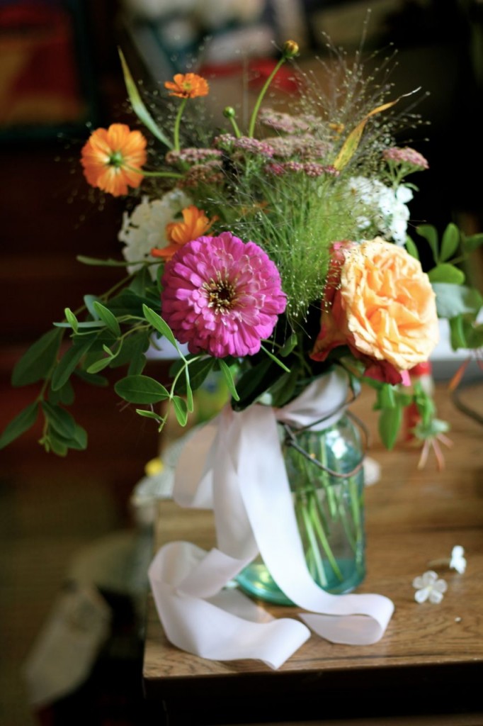 We borrowed a couple of boxes of these darling vintage canning jars for the flowers on the tables.