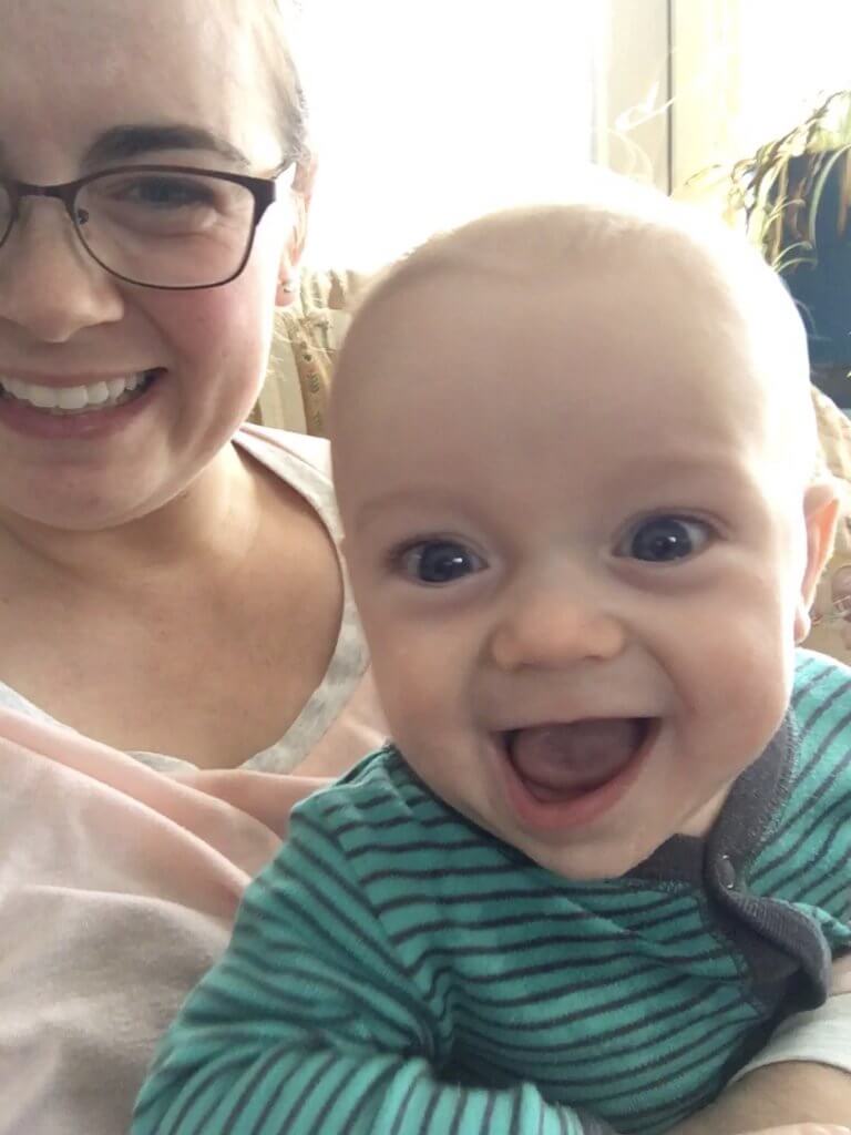 smiling baby with pretty mama