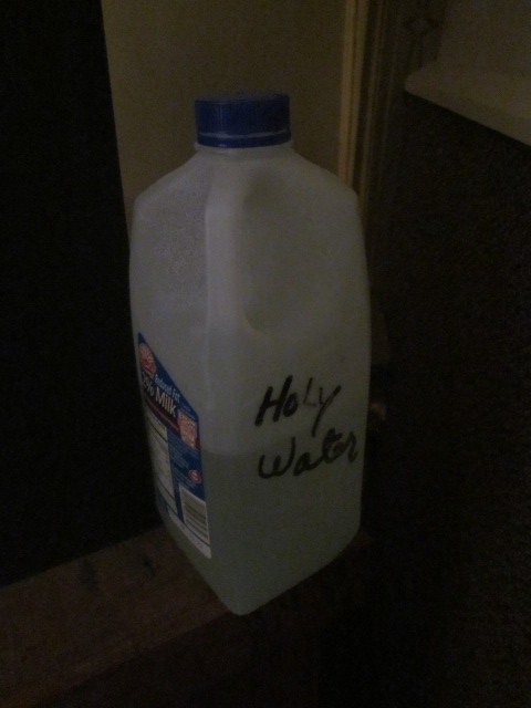 "Holy water" in church in milk jug