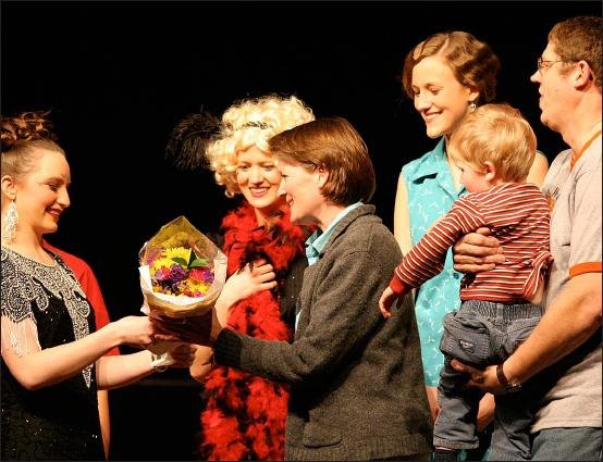 Here Bryan (holding little Mack) and I accept flowers from the cast after the show is finished.