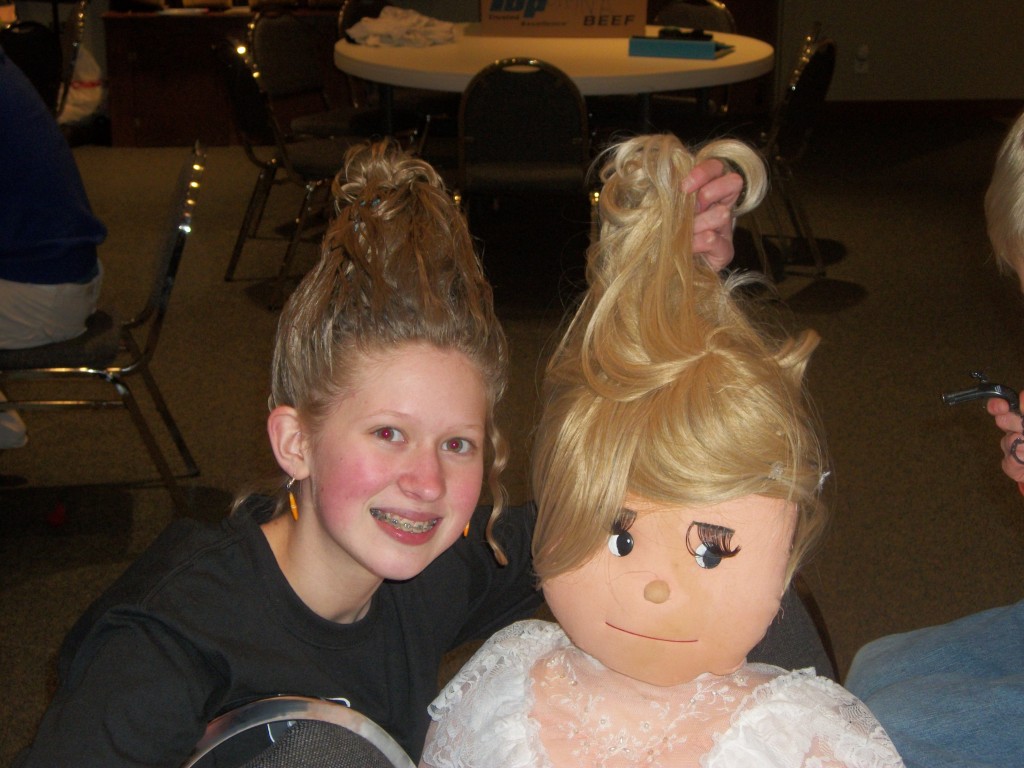 Even the dummy, Prunella, has big hair and is yukking it up with Amalia.