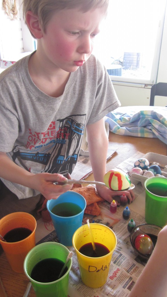 Little Mack takes his egg-dying responsibilities very, very seriously.