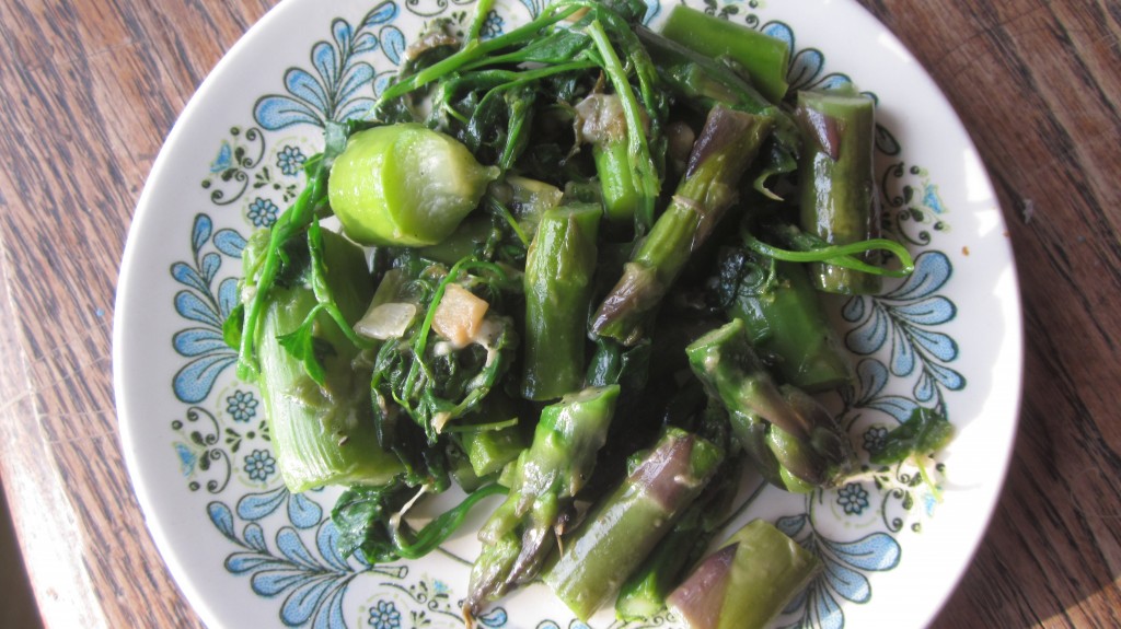 In this dish, I sauteed garlic and onion in a bit of olive oil, then added some chopped asparagus for a brief steaming, and then threw in a couple handfuls of lambsquarters and sauteed them briefly, until they were wilted.  Delicious!