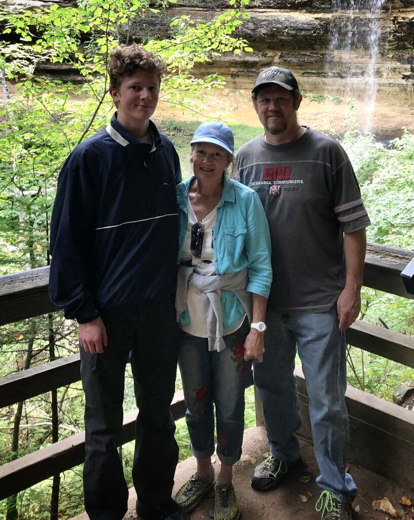 family with waterfall