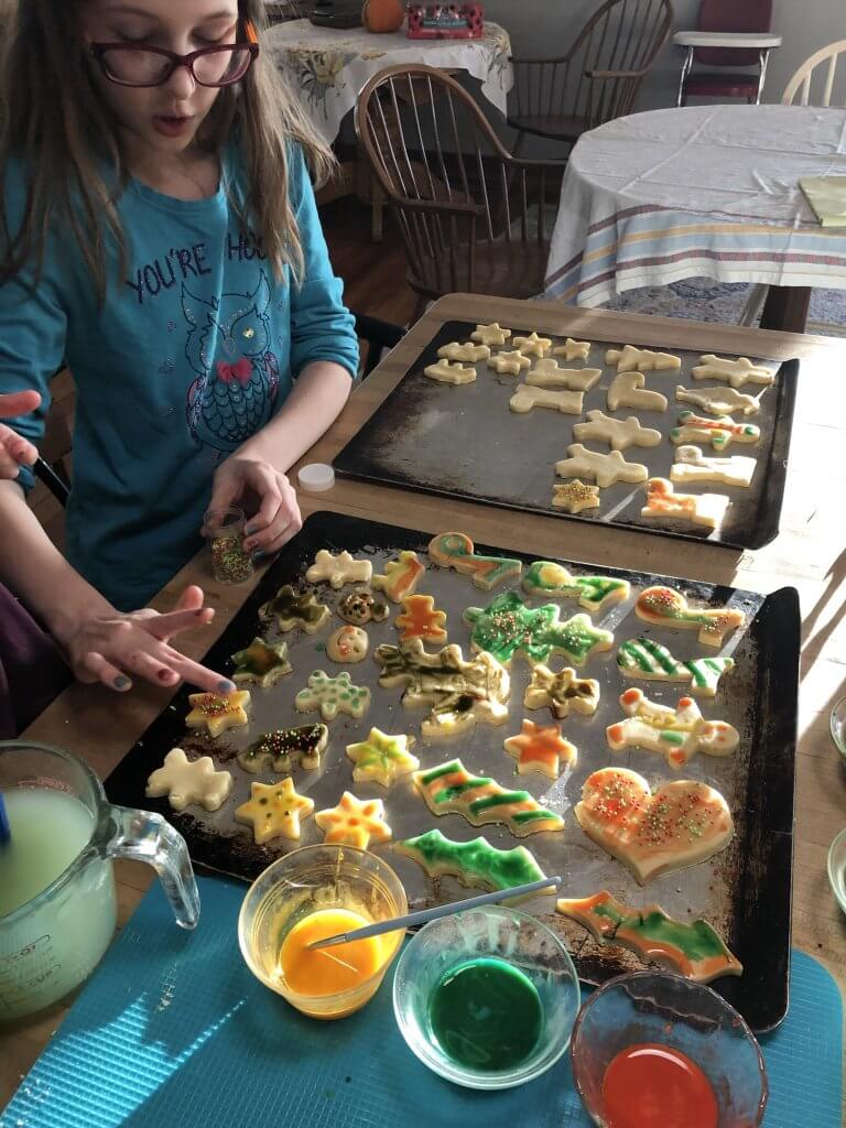 girl painting cookies