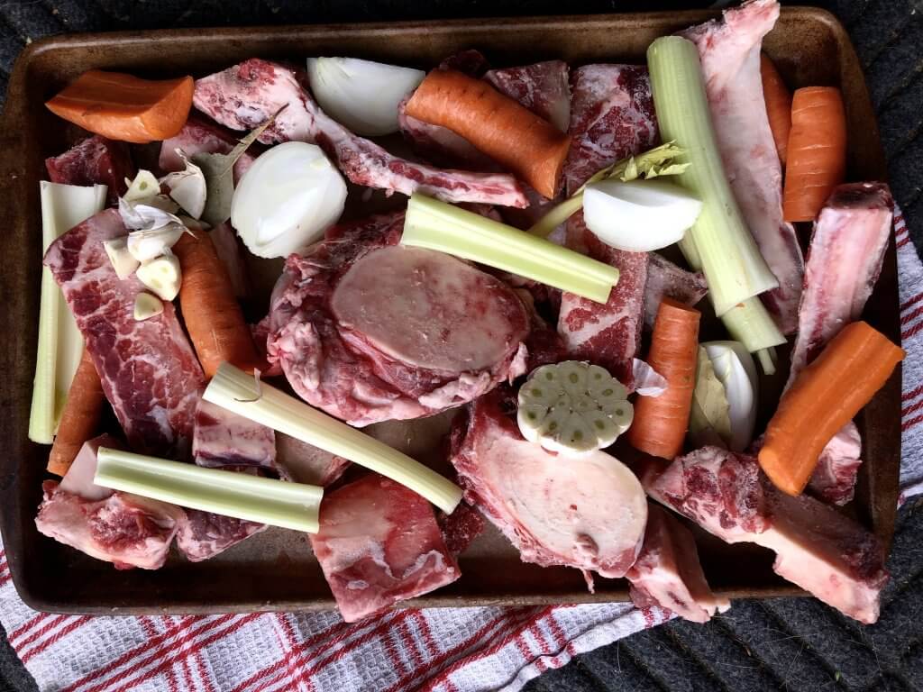 panful of raw beef bones and veg