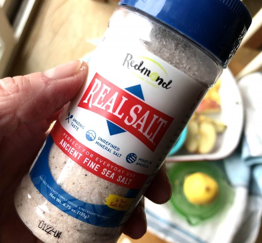 Redmond Real Salt shaker in hand