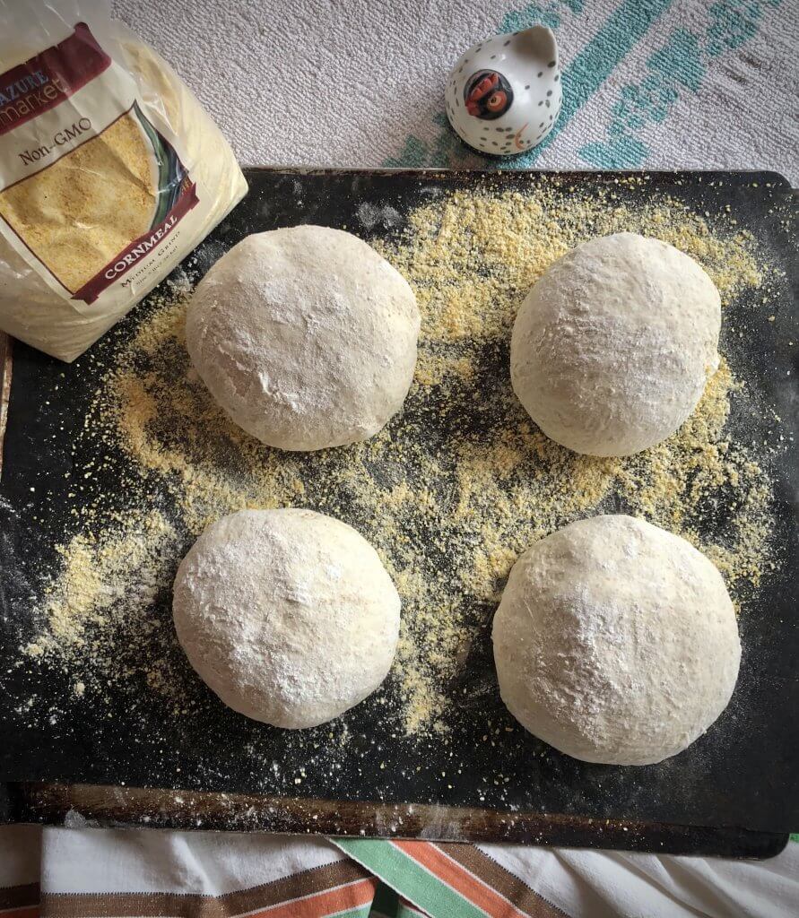 four round shaped balls of dough