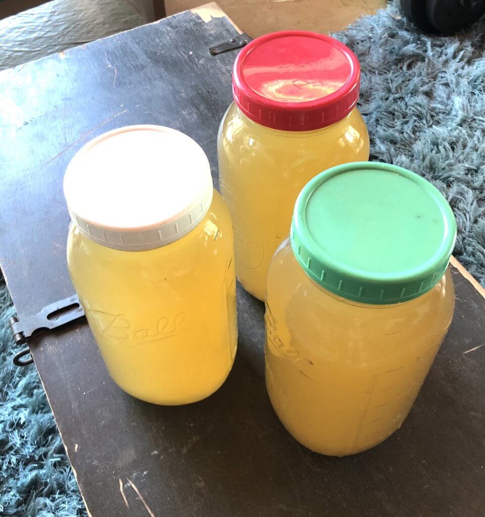 three big jars of pineapple tea