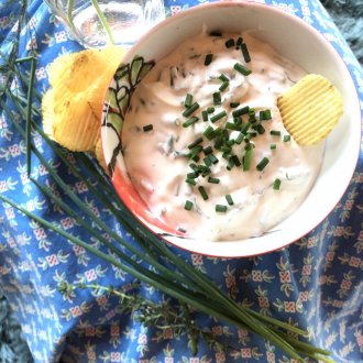 bowl of chip and dip on blue cloth