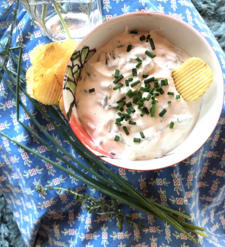 bowl of chip and dip on blue cloth