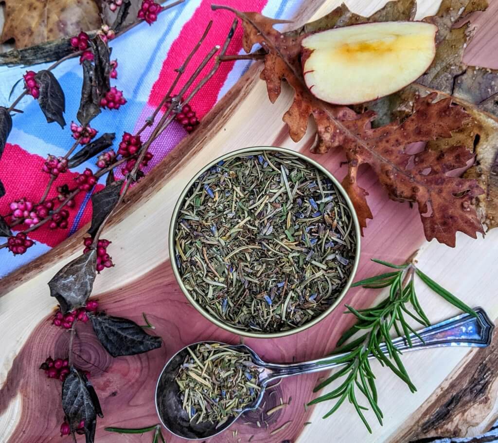 tin of dried herbs with fall leaves