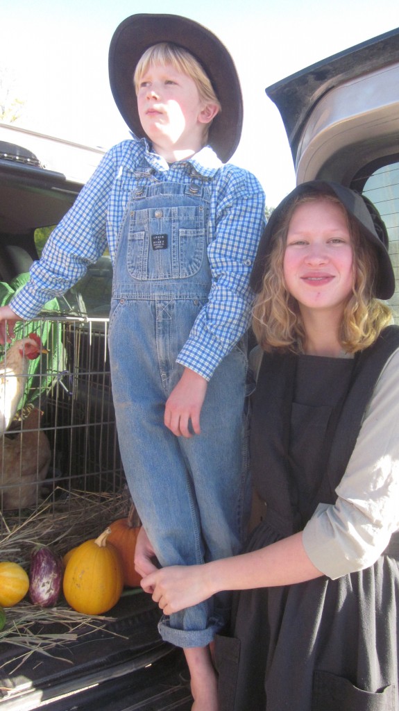 Here are my two little prairie children and a favored rooster, at our church's Trunk or Treat affair.