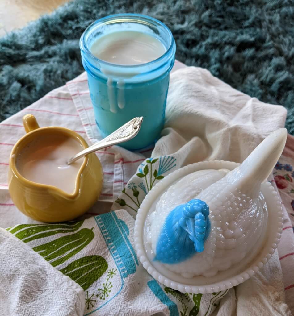 buttermilk in cup and antique chicken dish