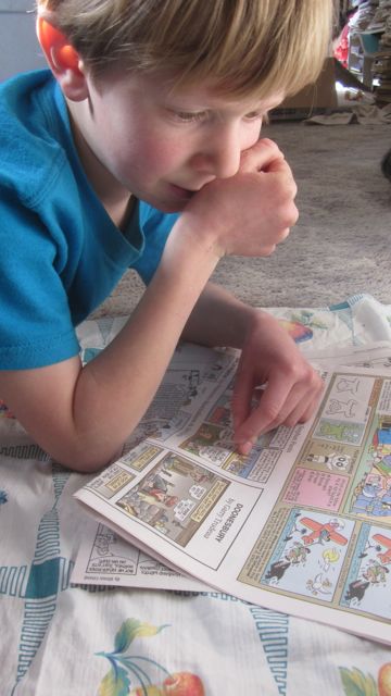 I love this little man of mine so much. When he wasn't helping me tug the bottle out of the paper pots, he was reading the comics to me.