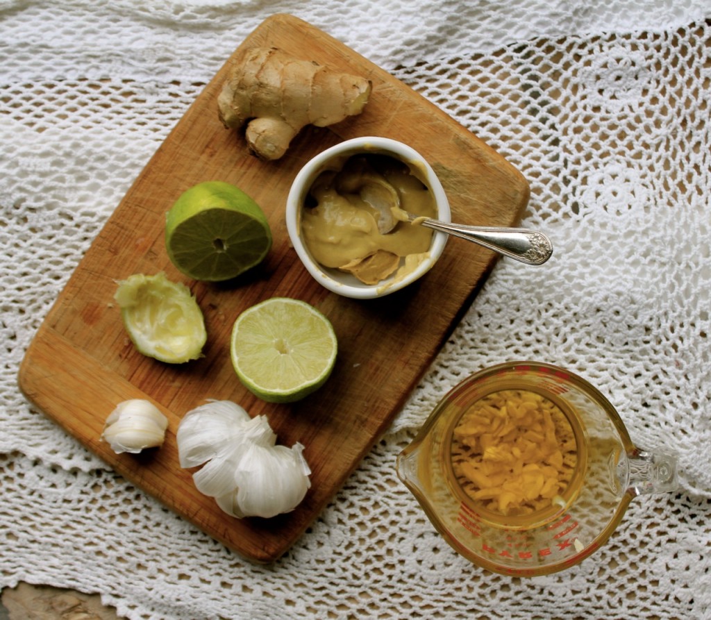 cutting board with ingredients for salad dressing