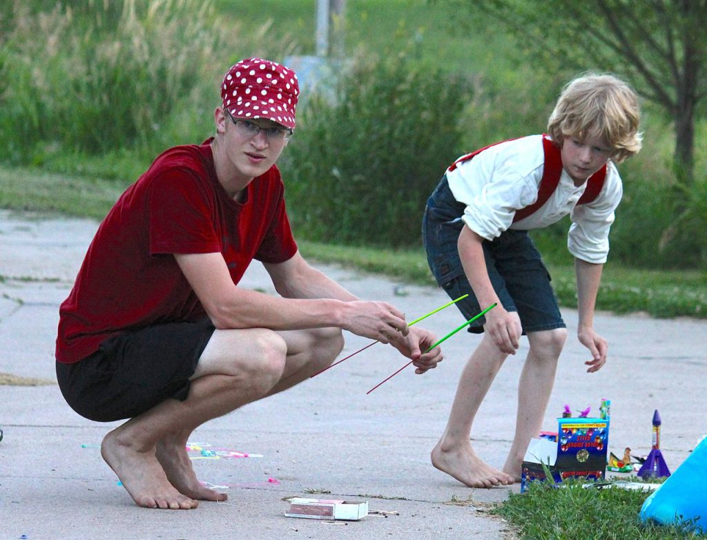 I love this picture from last Fourth of July, of Timothy and Mack shooting off fireworks. Please avert your eyes from their bare feet. Really. Who lets their boys shoot off fireworks with bare feet? *blushing*