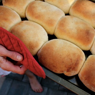 hand holding pan of runzas