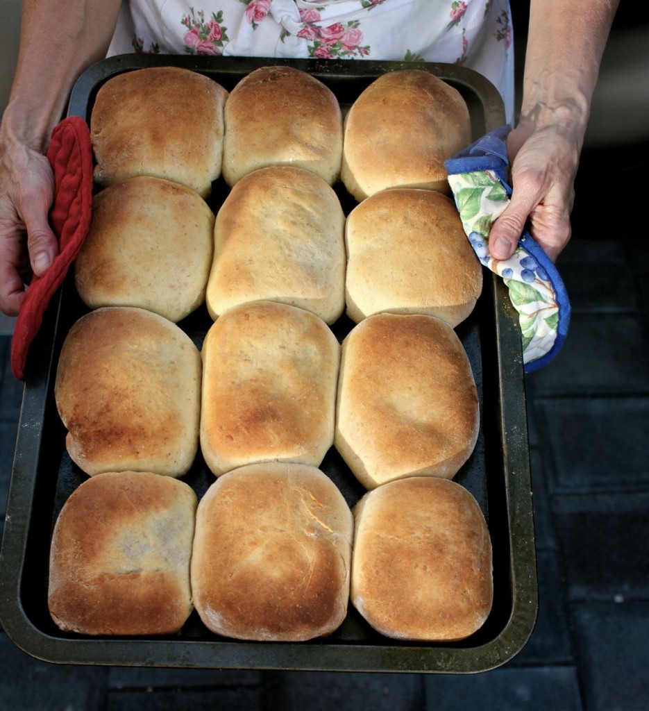 best runza recipe; runzas on a sheet with hands